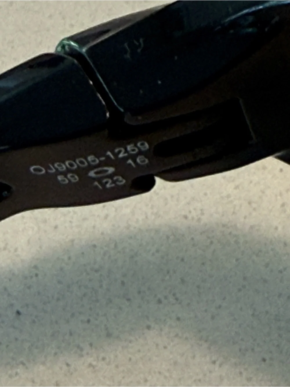 Oakley Gloss Black Frame Sunglasses with Red-Orange Mirrored Lenses